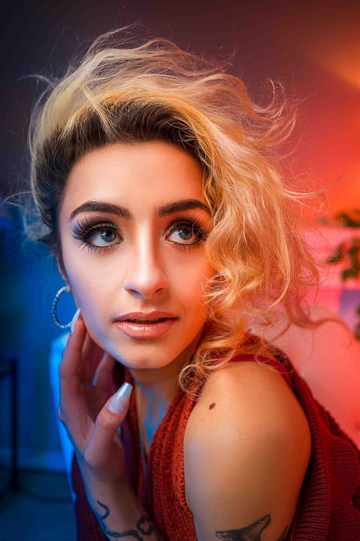 Confident woman with bold makeup and colorful lighting — Empowering Portraits by Nickolaus21 Chicago